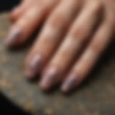 Close-up of a beautifully manicured nail with intricate design