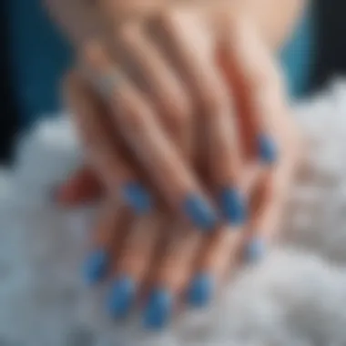Frosty Blue Nail Art An artistic nail design featuring a frosty blue polish with glitter accents.