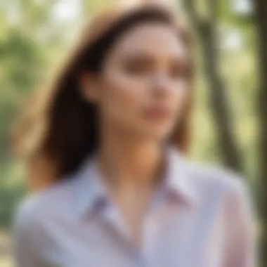 Woman wearing a pastel-colored shirt in a park