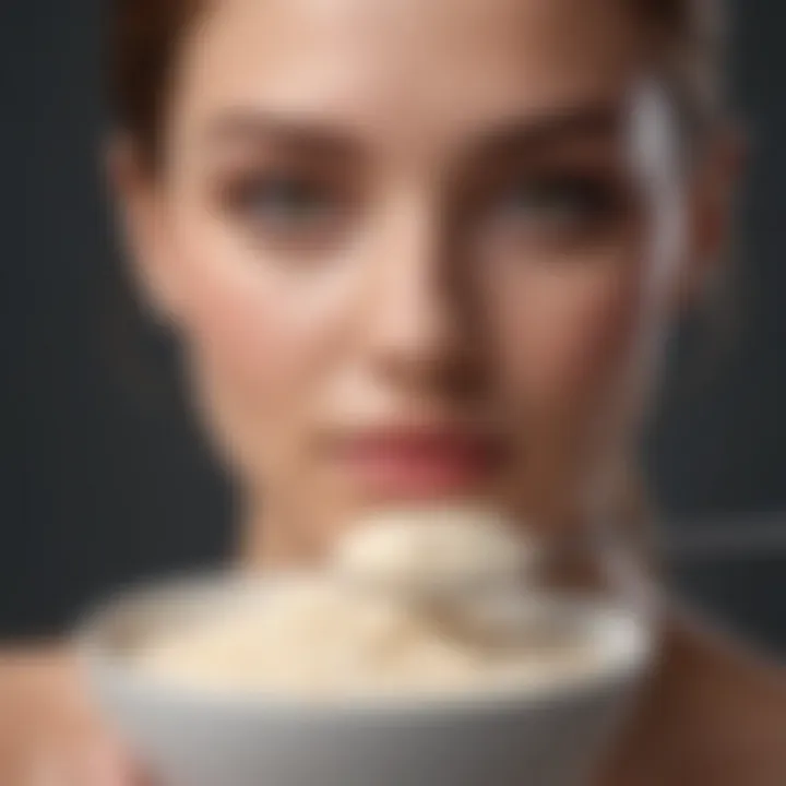 Close-up of collagen powder being measured with a spoon.