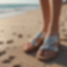 Stylish summer sandals on a beach