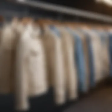 Different styles of cream denim jackets displayed on hangers.