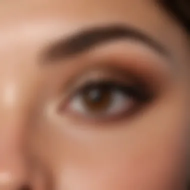 Close-up of expertly blended neutral eyeshadow on brown eyes