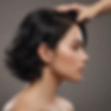 A stylist applying shampoo to Black hair