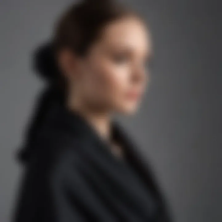 Stylish black cashmere wrap draped elegantly over a minimalist outfit