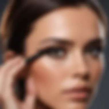 Makeup artist applying Victoria Beckham Eyeliner Pencil to enhance eye beauty