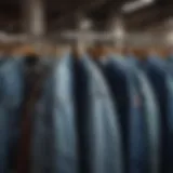 Various styles of jean jackets displayed on a rack